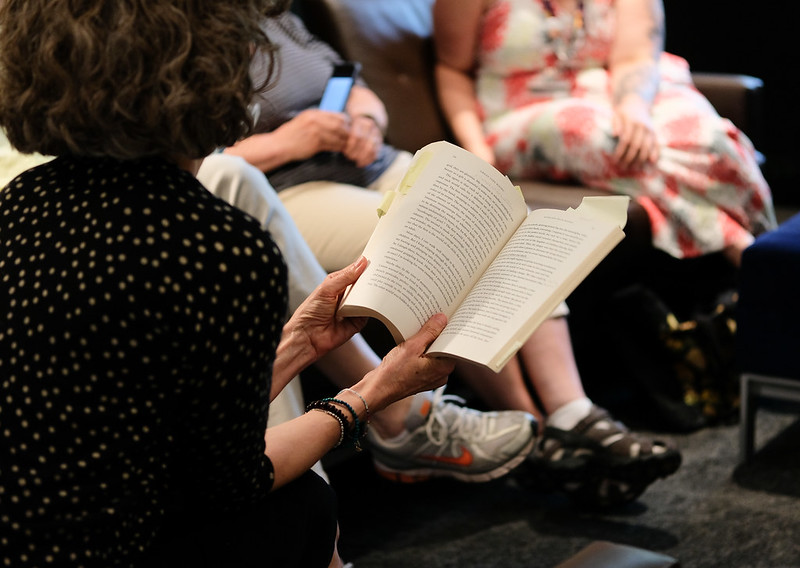A woman holding an open book