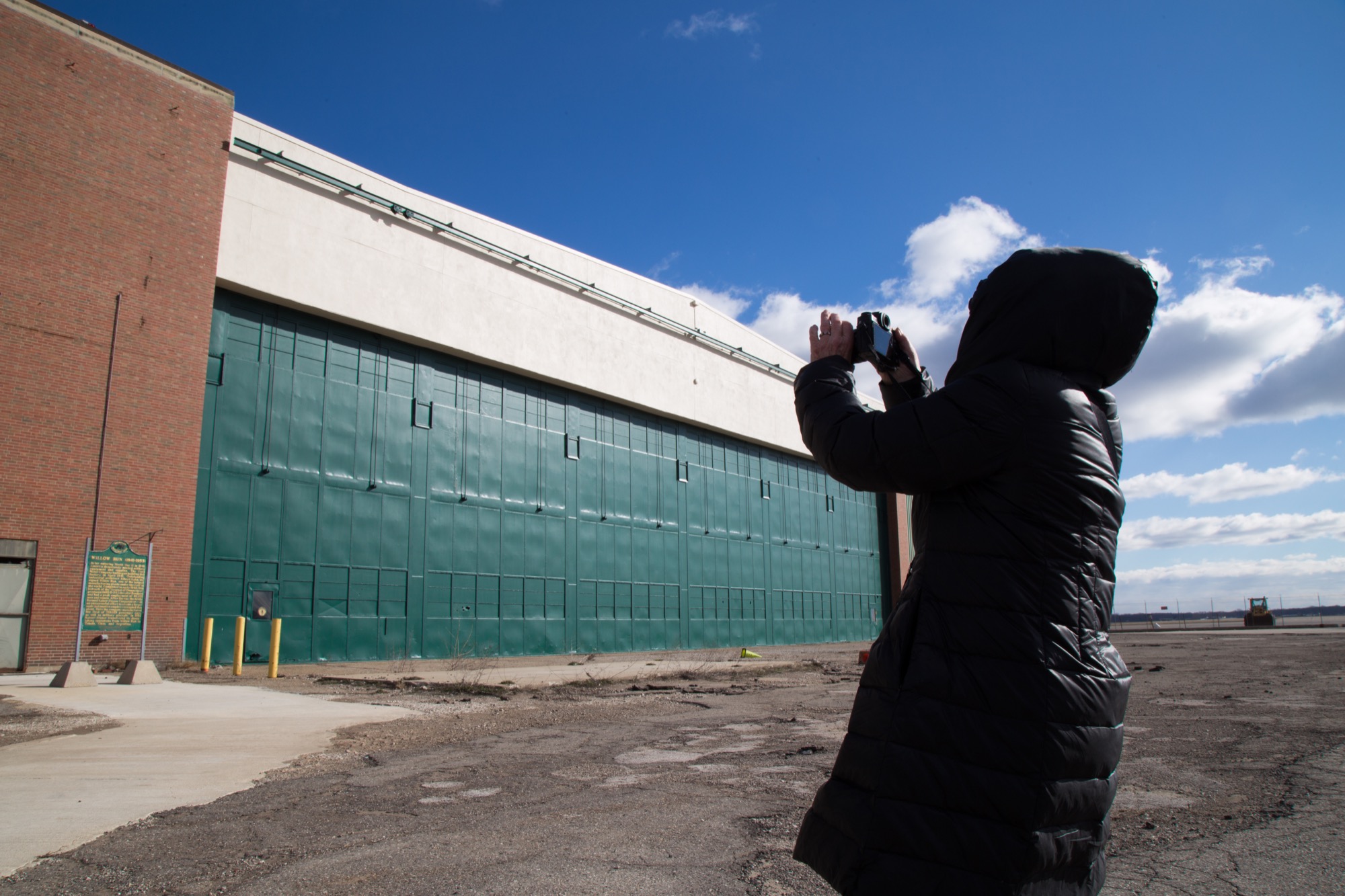 Ruben photographs the exterior of Willow Run. 