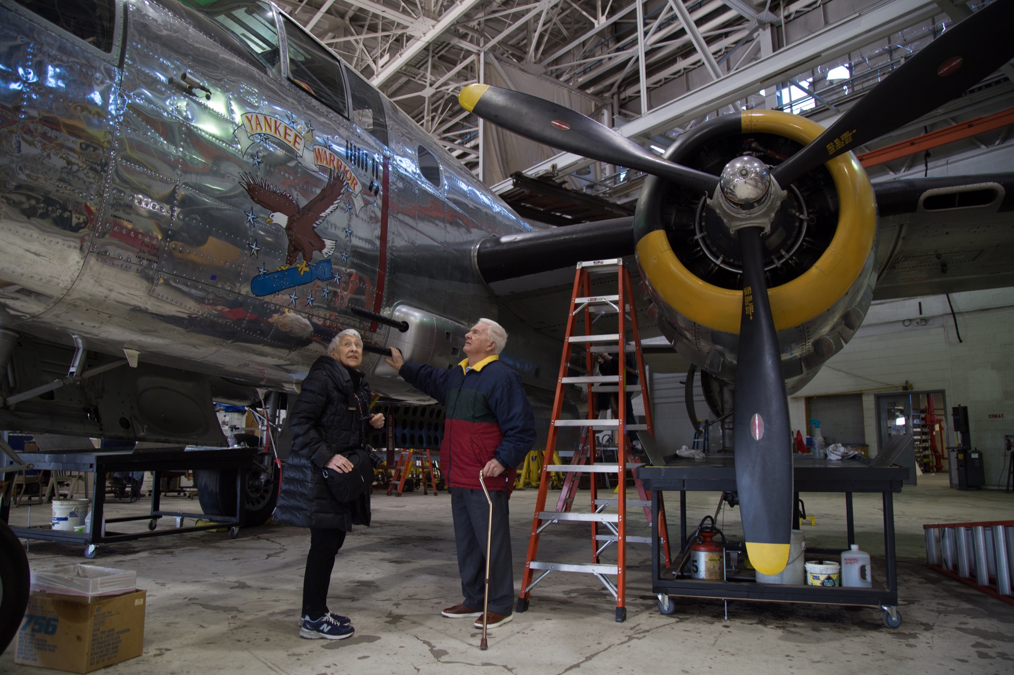 Ruben with her brother, Harry Winston, Jr., in the Yankee Air Museum’s storage as they look over bomber planes created at Willow Run.