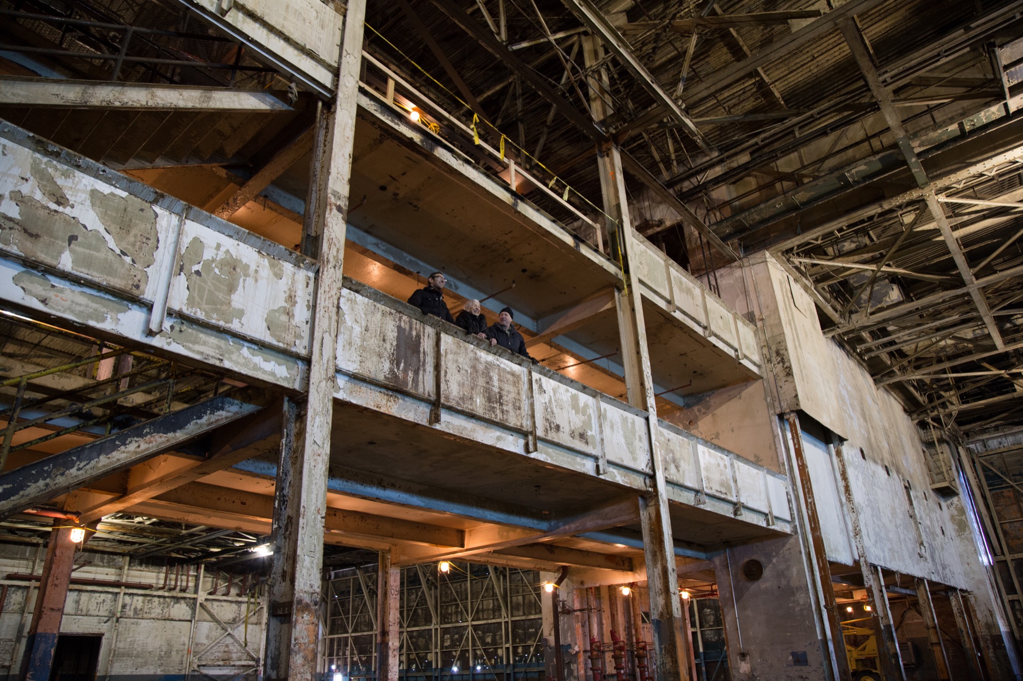 Ruben, Bernstein, and Hartke, observe the factory from above. 