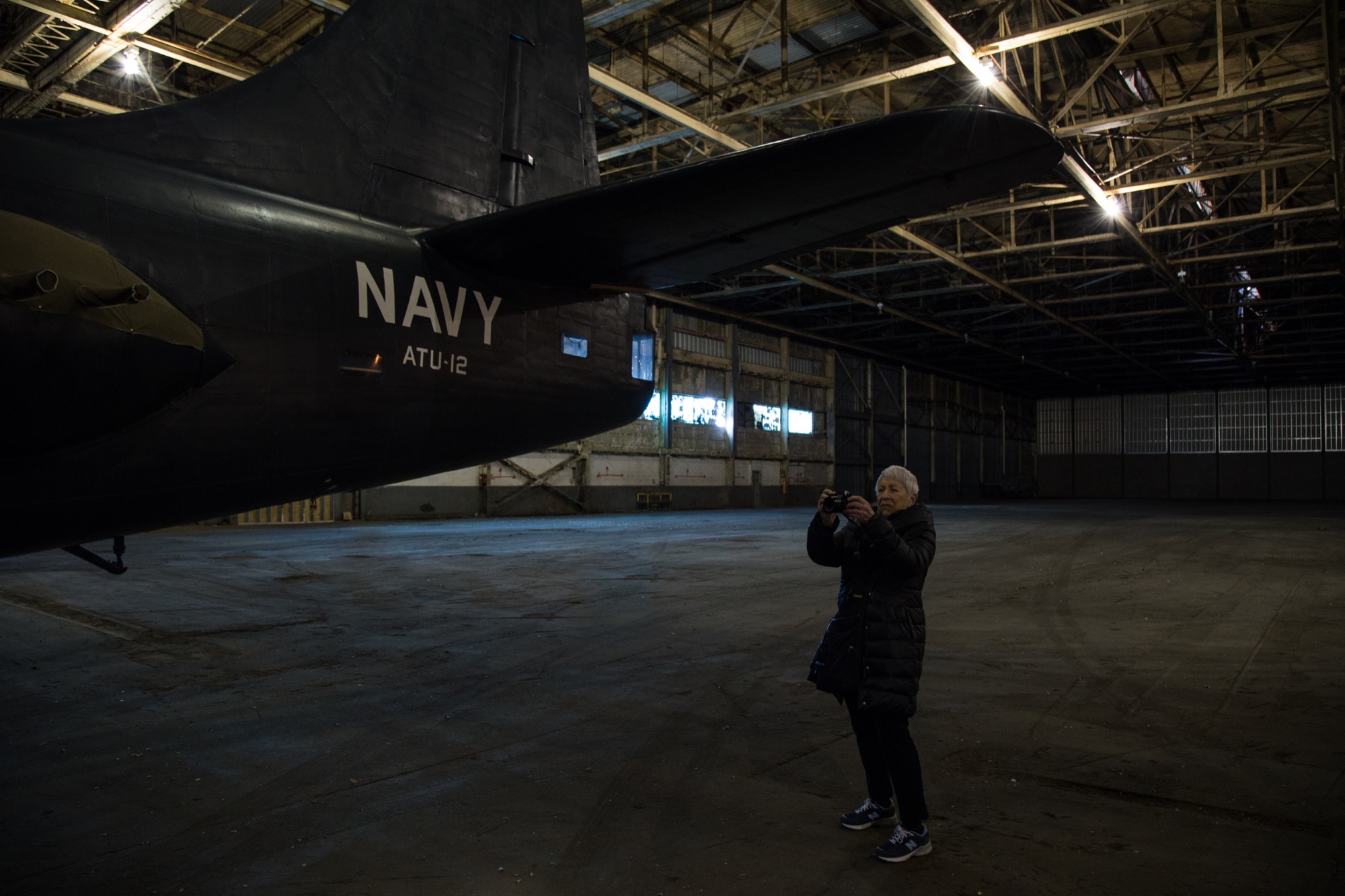Ruben photographs a bomber in the factory.