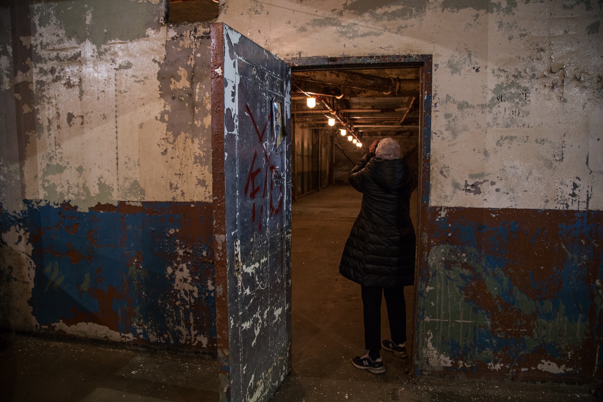 Ruben enters a sub-room of the factory space. 