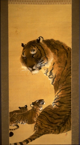 Two cubs lay beneath their mother, whose back is to the viewer, yet curves her head around to face outwards. Her eyes are golden, and look out towards the viewer. One cub looks up at its mother with closed eyes. The mother's white whiskers stand out against the otherwise warm, golden tones of the painting.